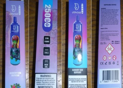 Fialovo-modré krabičky s elektronickými cigaretami GRIN BAR