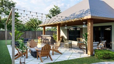 Vydlážděná terasa s dřevěným a ratanovým nábytkem a se zavěšenými světelnými řetězy