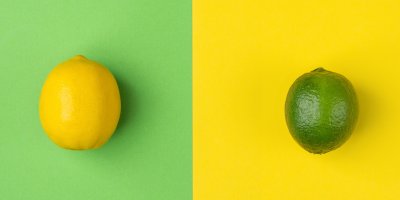 Limetka a citron na kontrastním, žluto-zeleném pozadí